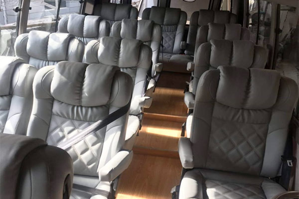 Toyota Coaster Modified Big Seats - 14 Seater - Luxury Imported Van Hire - Car Rental Delhi