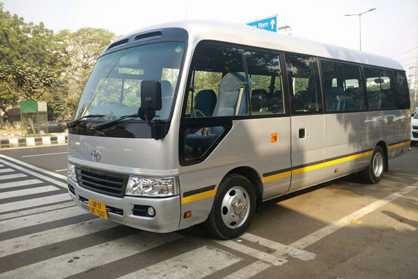 Toyota Coaster Modified Big Seats - 14 Seater - Luxury Imported Van Hire - Car Rental Delhi