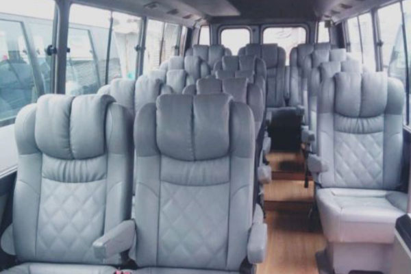 Toyota Coaster Modified Big Seats - 14 Seater - Luxury Imported Van Hire - Car Rental Delhi